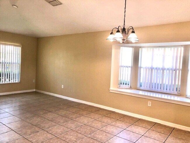 Building Photo - EAGLE CREEK LAKE NONA! WELCOME HOME! Beautiful water views! Spacious 2 story-3 bedroom 2.5 bath h...