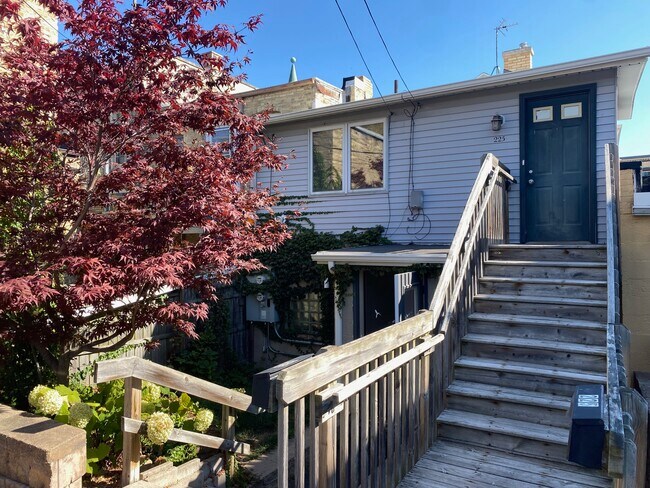 Entrance behind building with parking spots - 225 N Franklin St