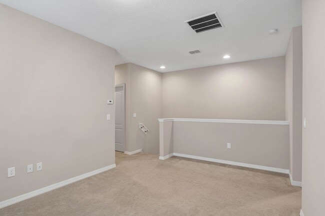 Building Photo - Spacious, Nearly New and Gated 3/2.5/2 Plu...