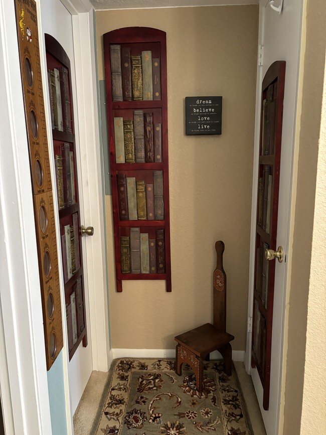 Faux Library corner entering the bath. - 3515 Sable Palm Ln