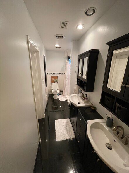 3rd bathroom with dual vanities - 2031 NW 8th Pl
