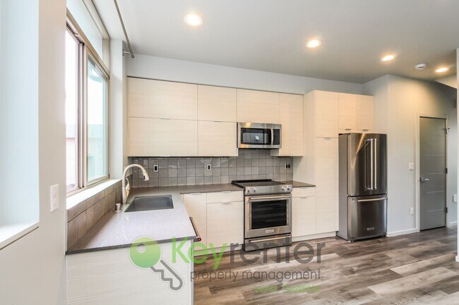 Building Photo - Modern 3 Bedroom with Rooftop Deck and In Unit Laundry