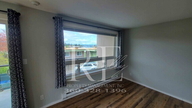Building Photo - Modern Manette 1BR Condo with Private Pati...