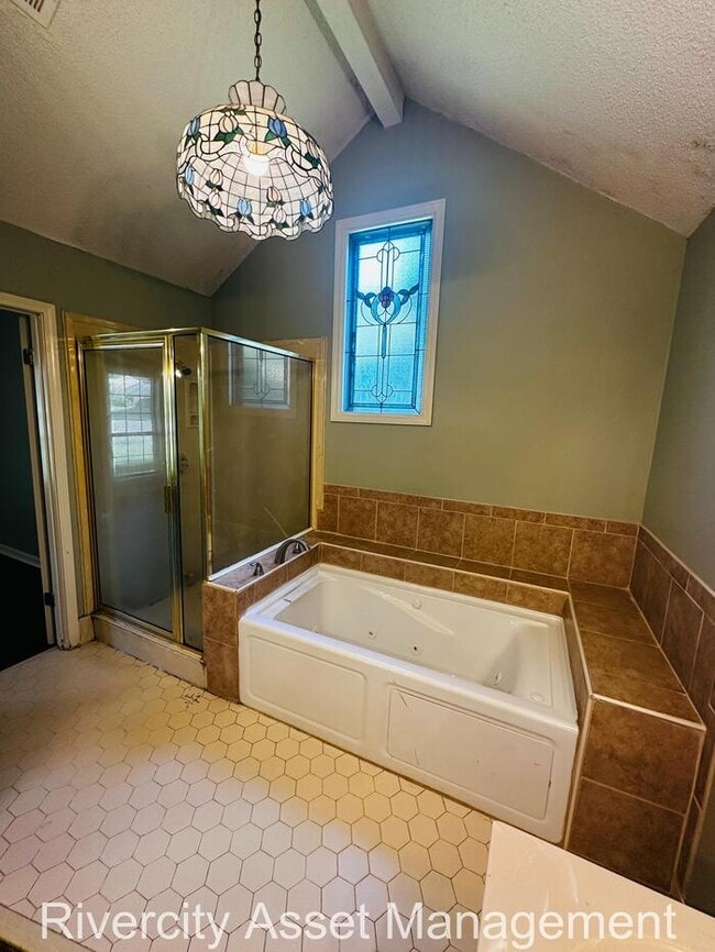 Building Photo - charming three-bedroom, two-full-bath resi...
