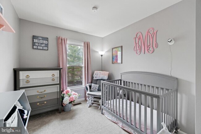 Baby furniture has been replaced with full size bed, end tables and lamp - 6908 Compton Valley Ct