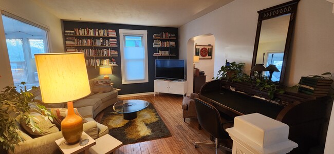 Living room with stylish accent wall. - 1023 28th Ave NE