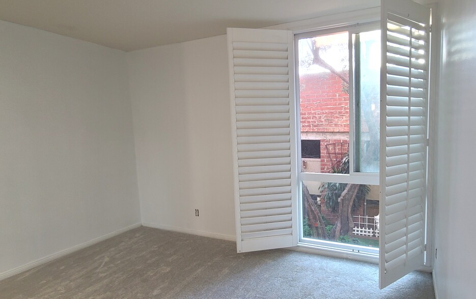 Bedroom 2 with shutter - 6375 Green Valley Cir