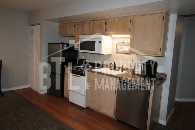 Building Photo - REDUCED PRICE! Fully Furnished One Bedroom...