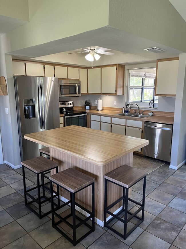 Modern stainless steel appliances. - 247 SE Santa Barbara Pl