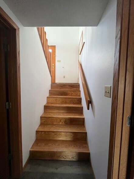 Stairs leading to front and garage door and upstairs - 1429 Franklin St