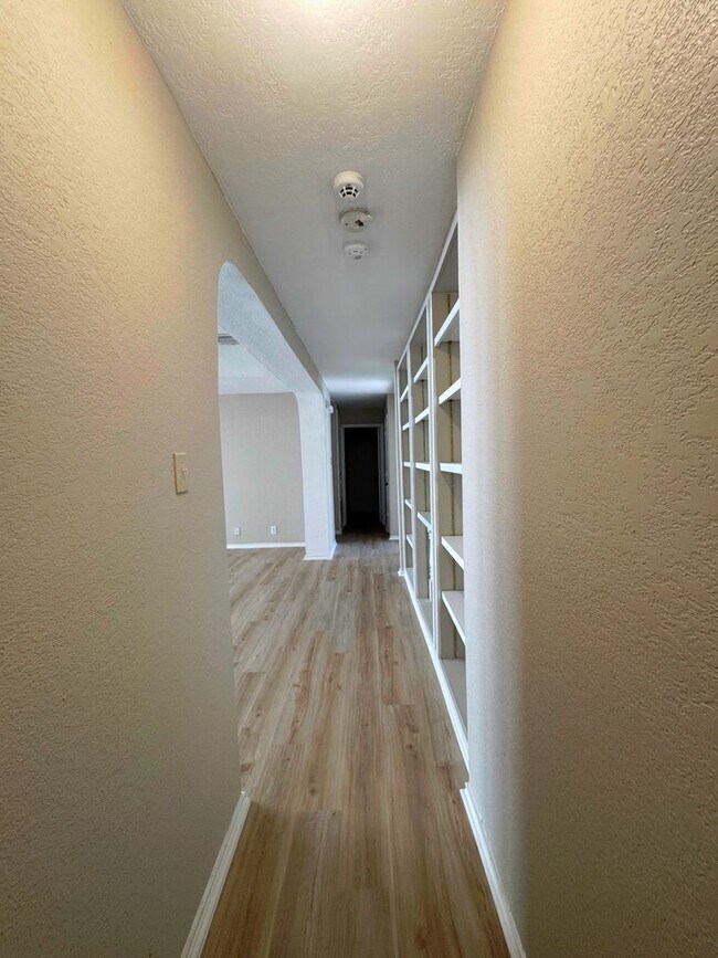 Building Photo - NEW PAINT, FLOORING, APPLIANCES & ROOF  | ...