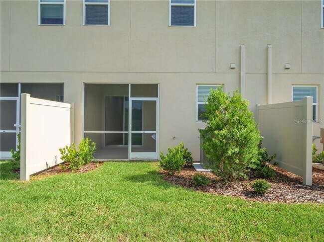 extra space in the backside of the townhouse, lawn maintenance is included in the rent. - 1074 Amber Leaf Trail