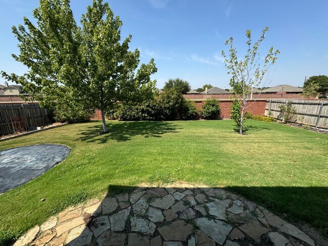 Building Photo - Argyle ISD Gem with Huge Private Backyard & Open Floorplan