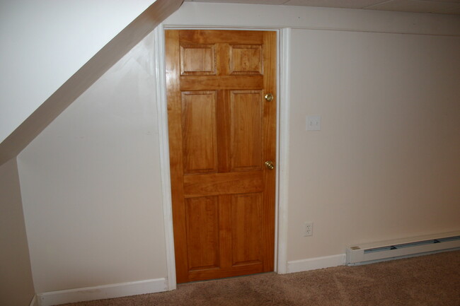 Wall and door between finished basement and laundry/storage area - 503 Center St