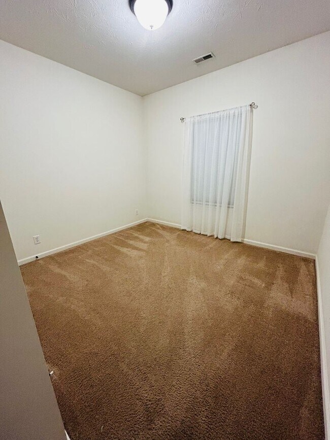 Building Photo - House with Fenced Backyard