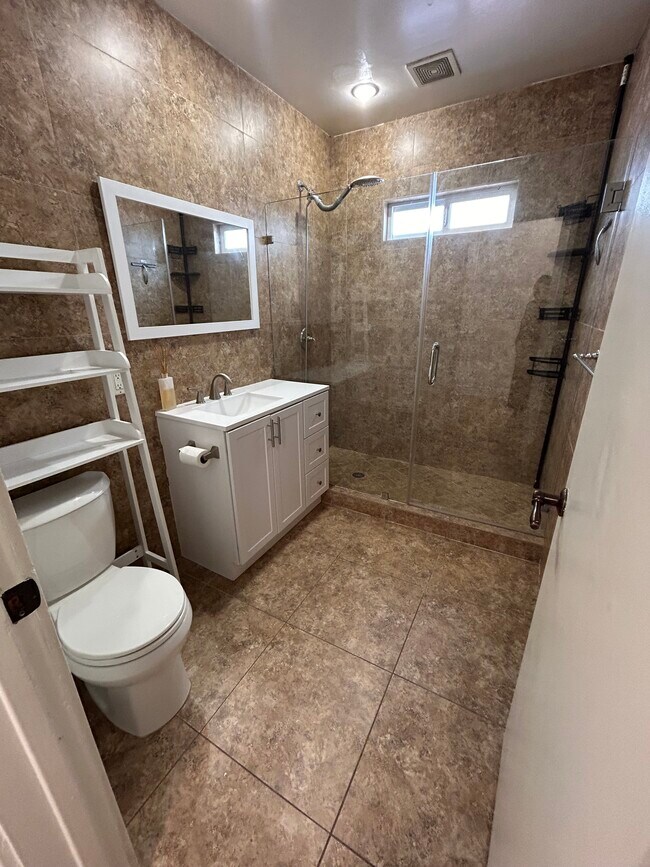 Remodeled vanity + walk-in shower - 1139 S Highland Ave
