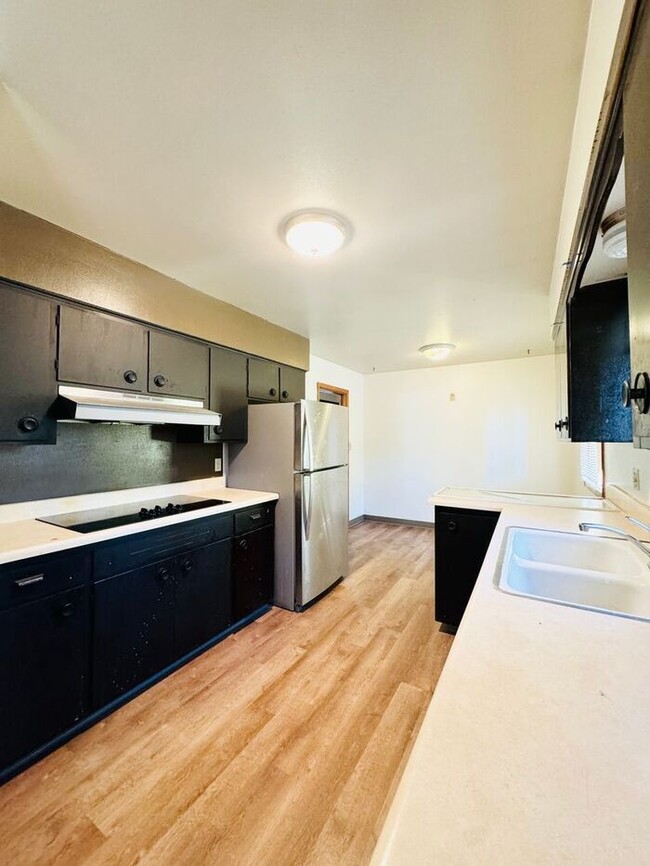 Building Photo - First Month Free - Spacious 4 bedroom 2 ba...