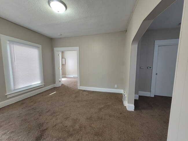 Building Photo - Two bedroom home with partially fenced yard!