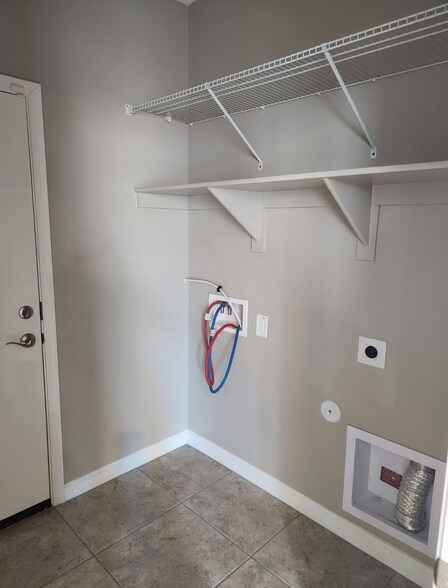 Laundry room and garage access door - 38221 W San Ildefanso Ave