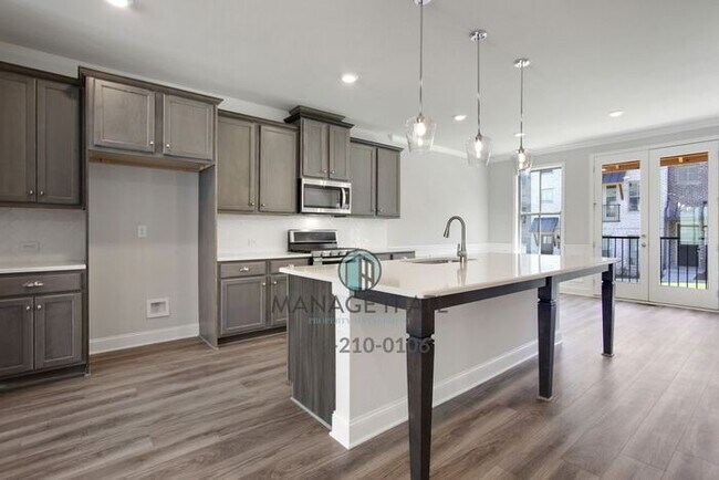 Building Photo - Modern 3-level Townhome featuring 4 bedrooms and 3 1/2 baths