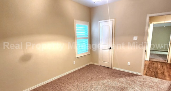 Building Photo - Well-Planned 4BR/3BA—Space for Guests, Off...