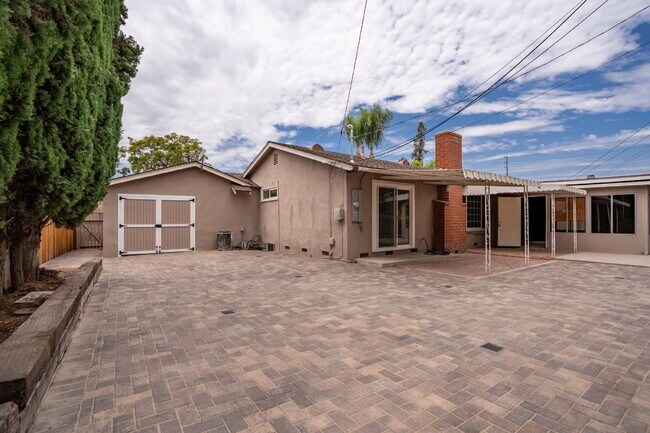 Building Photo - Charming Updated Home With Drive-Through Garage Access