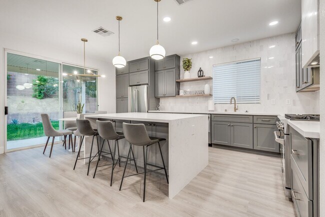 Building Photo - FULLY FURNISHED! Exudes sophistication with designer touches throughout