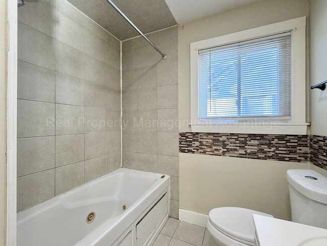 Building Photo - Solid Brick and Renovated with New Kitchen and Two Full Baths!