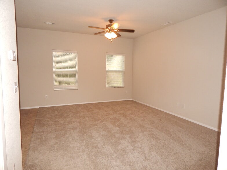 Roomy living area open to kitchen and dining. - 5074 W Claxton Circle