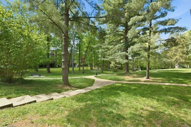 Building Photo - This expansive ground level residence is set within a serene, gated garden community surrounded b...