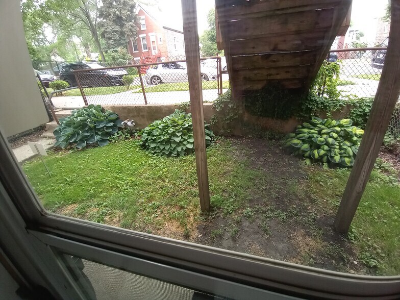 View through 1st floor front doo and steps away from Wilson Park - 3405 S May St