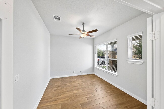 Building Photo - Greenbelt. 3 Car Garage. Built In Dog Room.