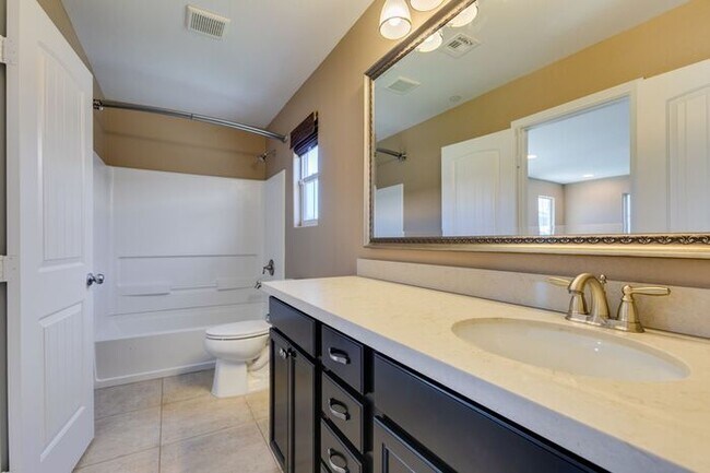 Building Photo - Better Than New with Stunning Designer Upgrades Throughout!