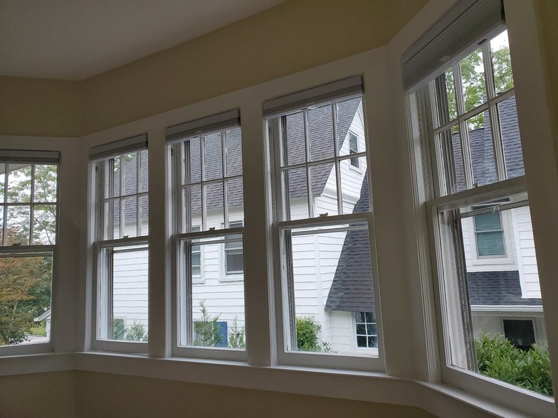 Wooden Bedroom windows with room dark blinds - 78 S Carll Ave