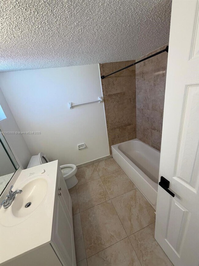 Building Photo - 10701 Royal Palm Blvd