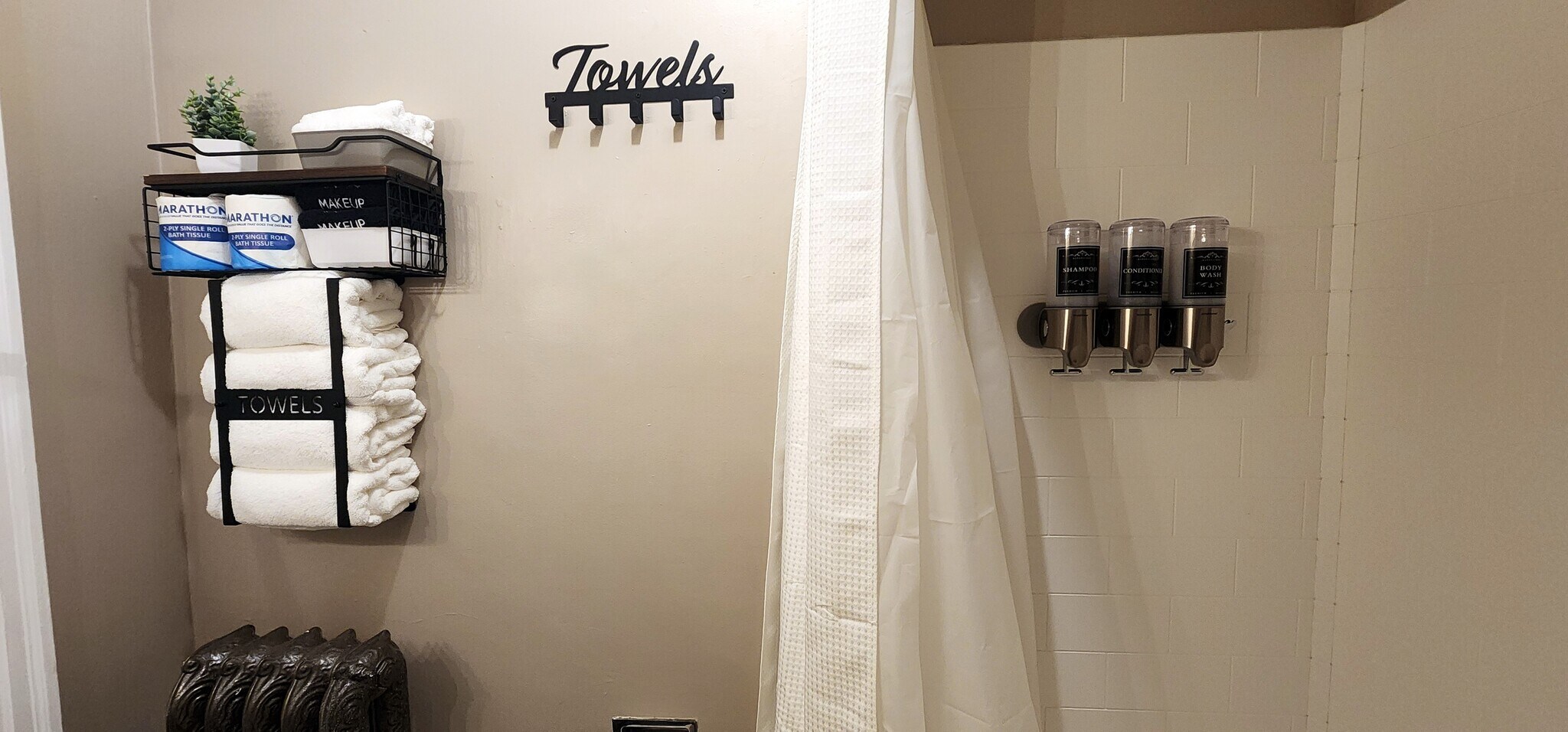 Full towel set with OEKO-TEX certified linens, toiletries, and in-shower dispensers. - 822 E 4th St