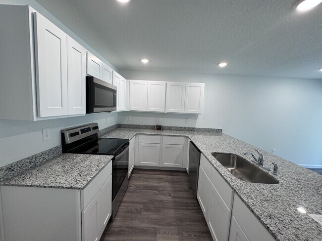 Building Photo - "Charming 4-Bedroom Home in Spring Hill, F...