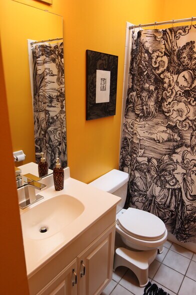 Bathroom with skylight, features tub and shower - 1626 Carroll St
