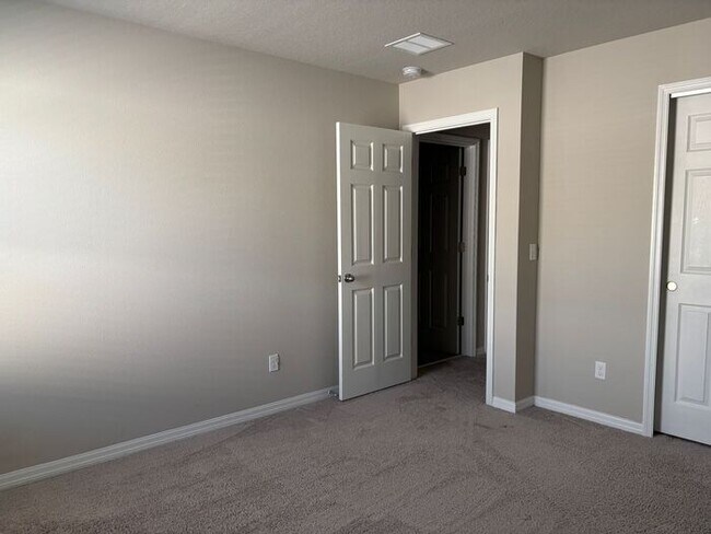 Building Photo - Like-New 4 Bedroom 3 Bath with Pond View & Two Living Spaces — Minutes to South Lake Nona
