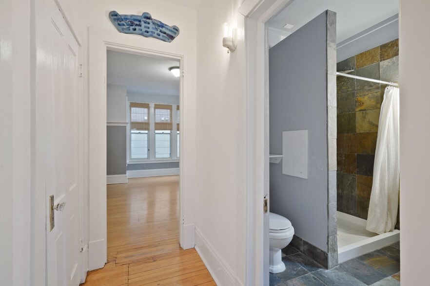 Hallway and bathroom. - 3032 grand ave