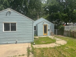 Building Photo - Perfect Home for You and Your Pup! Dog House Included + Fenced Yard
