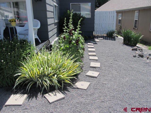 Side yard. - 165 NW 2nd St