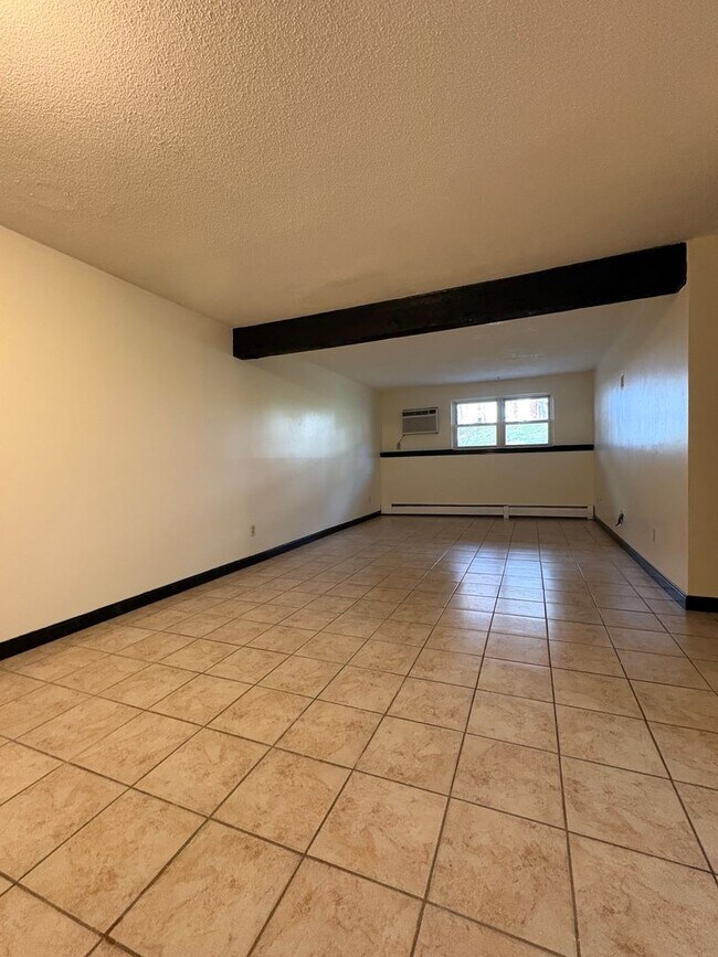 Building Photo - Rent reduced! Beautifully updated 2 bedroom condo, with 2 reserved parking spots, in Dracut MA