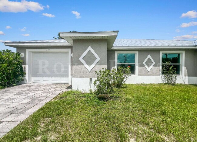 Building Photo - Spacious 3BR/2BA Duplex in Lehigh Acres & $500 Off Your First Month If You Apply by Aug 20th!