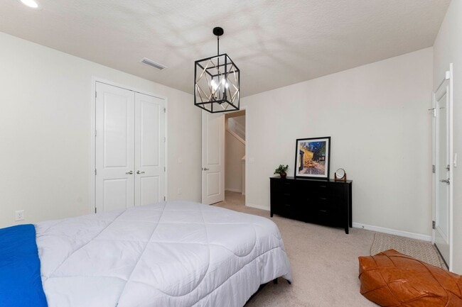 Building Photo - Introducing a captivating 3-story townhome...