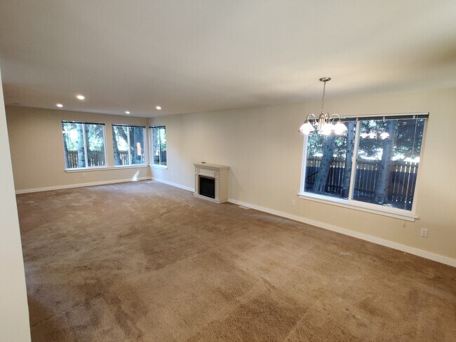 Spacious and lighted Living and Dining Area with fireplace - 17729 NE 88th Pl