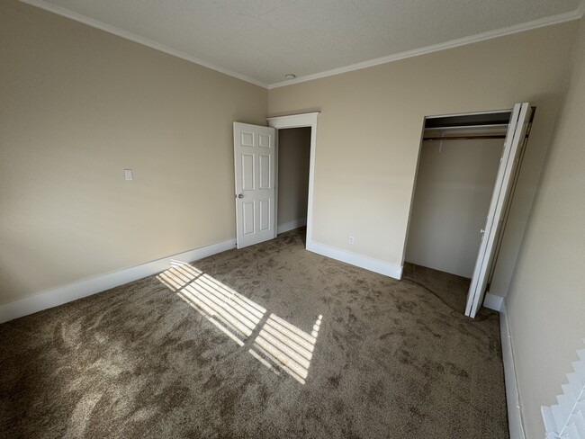 Newly renovated second bedroom. - 1749 E 3rd St