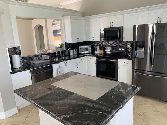 Building Photo - 7891 Manor Forest Blvd