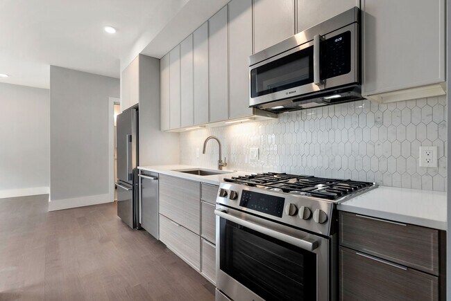 Building Photo - Jamaica Plain spacious studio w/ central a...