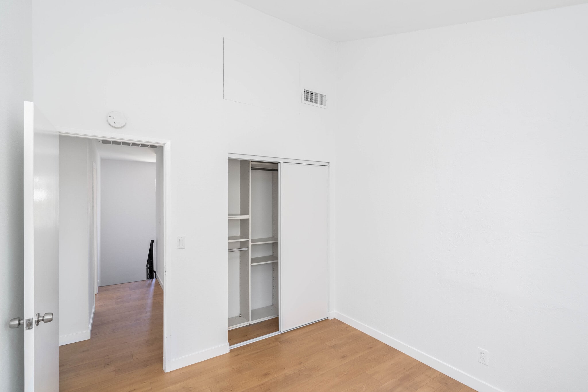Second bedroom with built-in closet organizers. - 744 N Dillon St